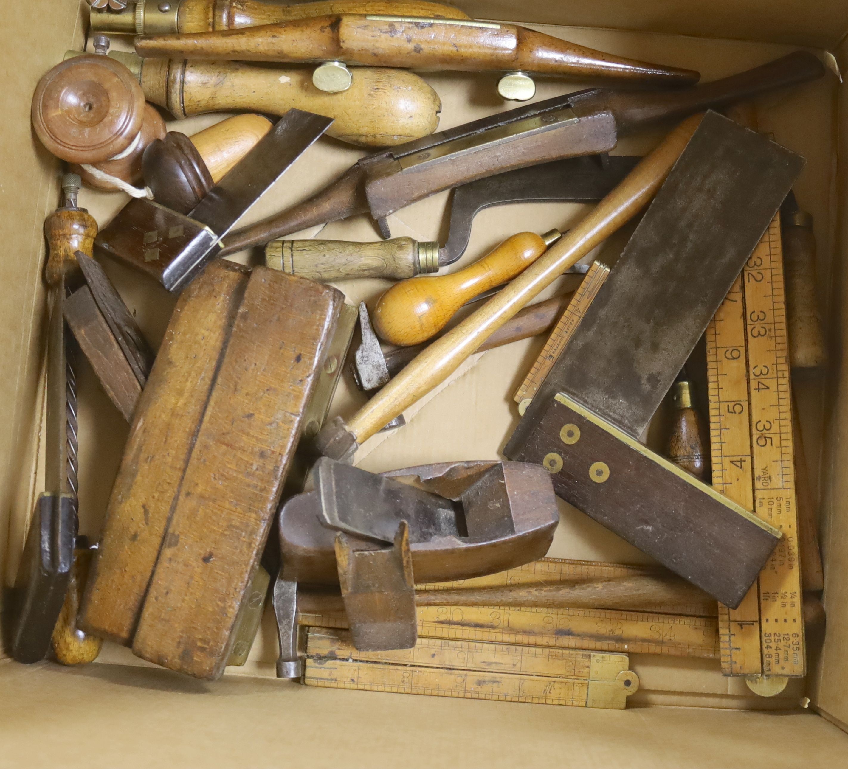 Carpenters tools: brass and mahogany set squares, rulers, small hammers etc.